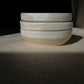 assiette ALPHA, petite assiette bi-colore : émail blanc et grès moucheté. Conçue pour l'usage quotidien ; salades, soupe, entrée, dessert ou tapas, l'assiette ALPHA se veut multiple. Dimensions : ∅. 16 x  h. 5 cm